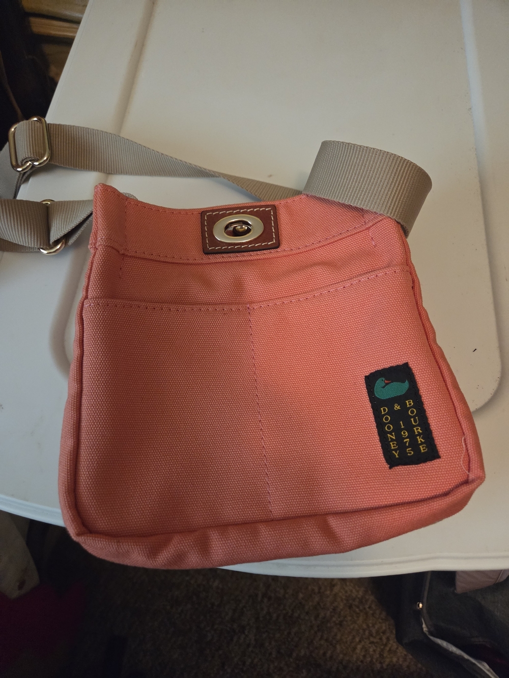 Dooney & Bourke Coral Canvas Crossbody Purse with Tan Strap